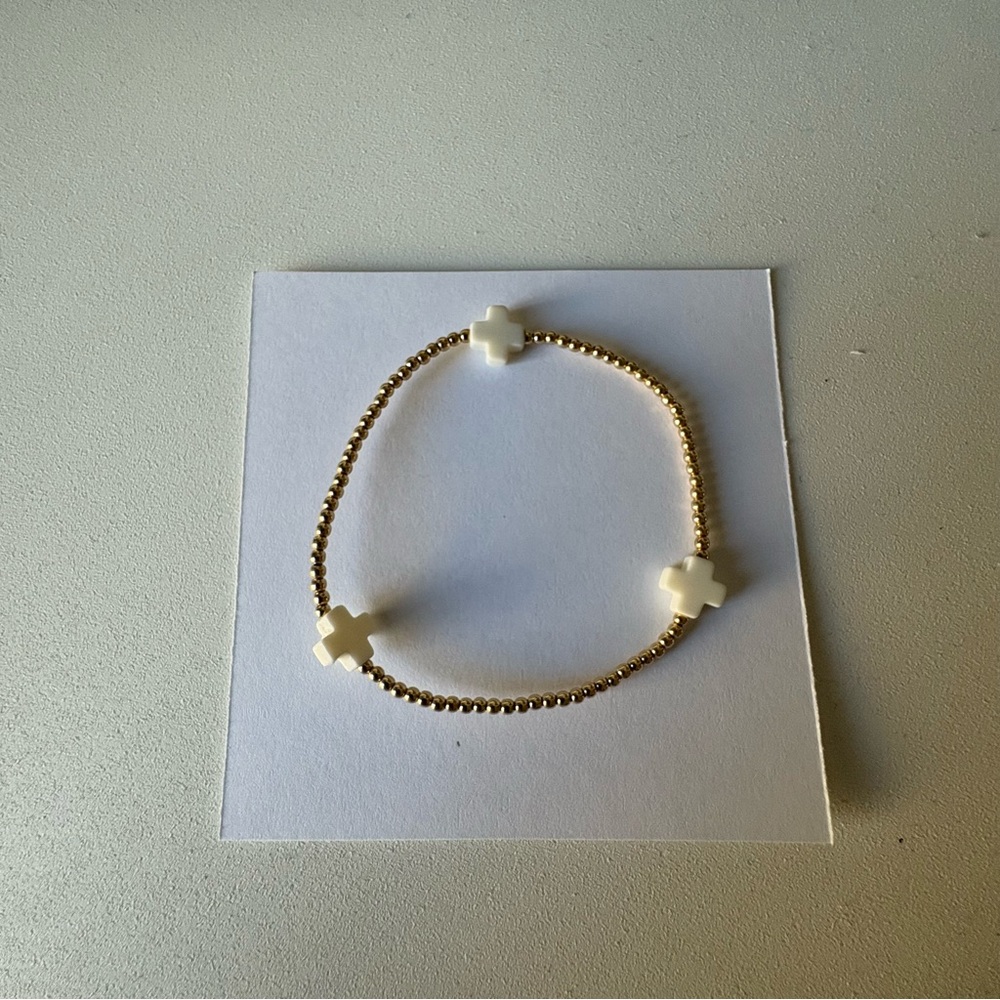 e newton white cross bracelet